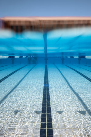 Underwater view of empty swimming pool lanes