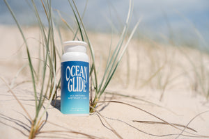ocean glide wetsuit lube on sand 
