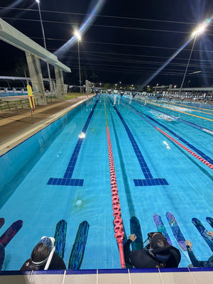 Night pool with apnea training divers and fins